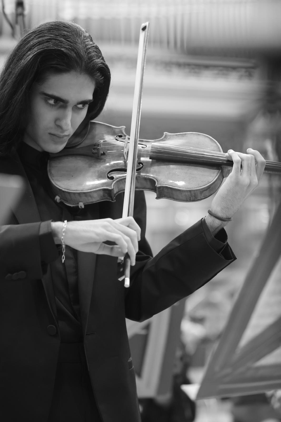 Antonio Piculeață performing on the violin, black and white